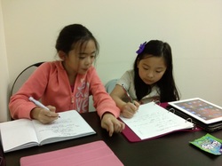 Children Writing in Class